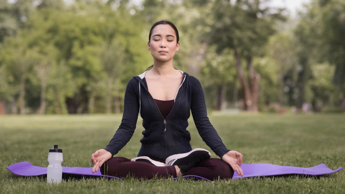 front-view-young-woman-doing-yoga-outdoors-1200x675.jpg